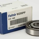 Close-up of a Fafnir W209PP ball bearing placed next to its branded blue and white box, displaying product identification details, barcode, and model number.